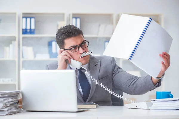 Businessman smoking in office at work — Stock Photo, Image