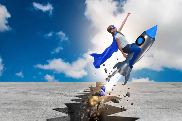 Superhero kid flying on rocket — Stock Photo, Image