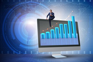 Grafiklerle ekonomi tahmini konseptinde iş adamı