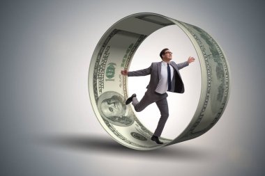 Hamster çarklı bir iş adamı dolarları kovalıyor.
