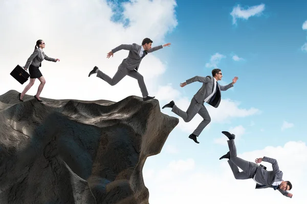 Business people falling off the cliff — Stock Photo, Image