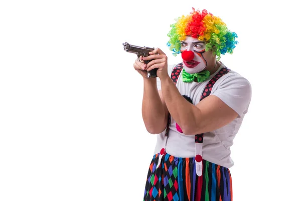 Смешной клоун с пистолетом на белом фоне — стоковое фото
