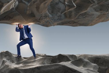 Baskı altında taşı destekleyen iş adamı