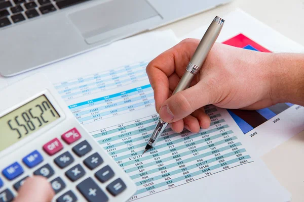 Finance analyst looking and financial reports — Stock Photo, Image