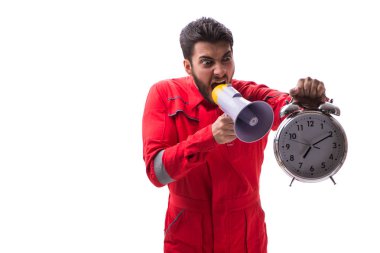 Bir megafon ve üzerinde izole bir çalar saat ile genç tamirci