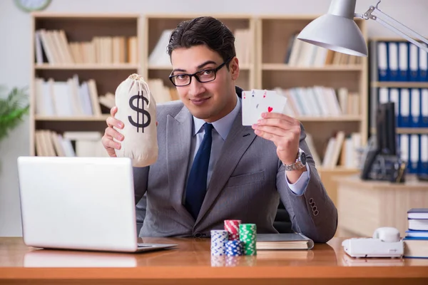 Businessman gambling playing cards at work — Stock Photo, Image