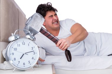 Yatakta uykusuzluk çeken bir adam.