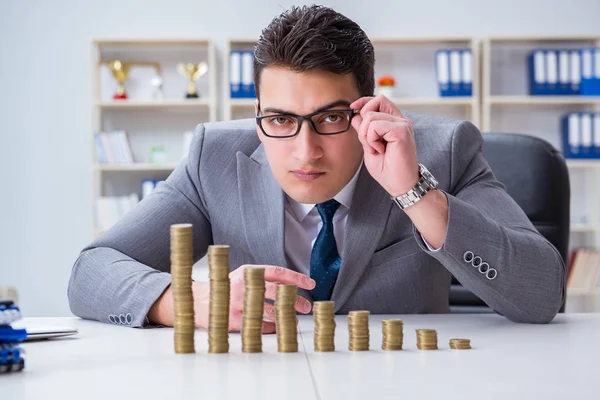 Businessman with golden coins in business growth concept — Stock Photo, Image