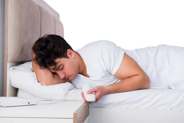 Man in bed suffering from insomnia