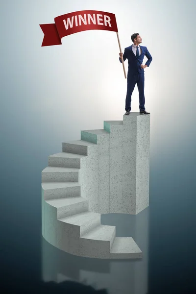 Businessman winner on top of staircase — Stock Photo, Image
