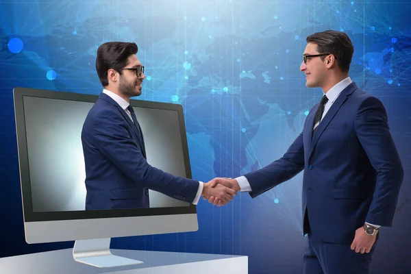 Telepresence concept met twee zakenman handshaking — Stockfoto