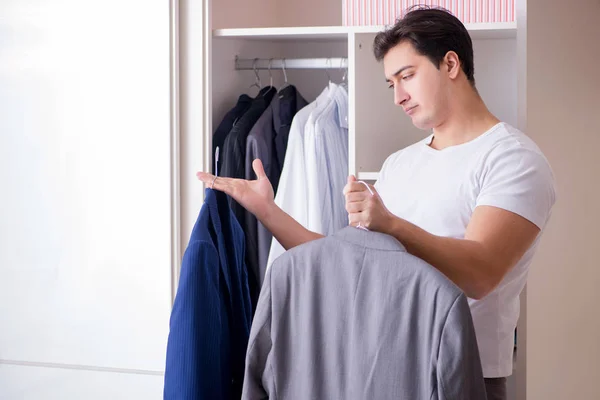 Young man businessman getting dressed for work — Stock Photo, Image