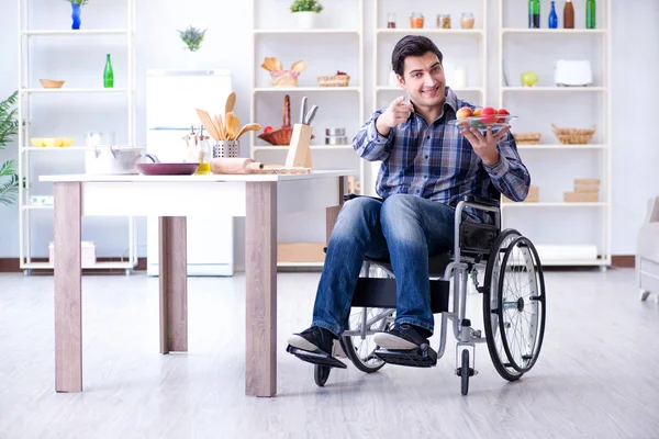 Young disabled husband preparing food salad