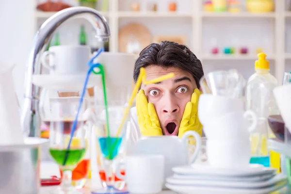 Man frustrated at having to wash dishes — Stock Photo, Image