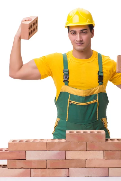 The handsome construction worker building brick wall — Stock Photo, Image