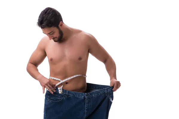 Mannen i bantning koncept med överdimensionerade jeans — Stockfoto