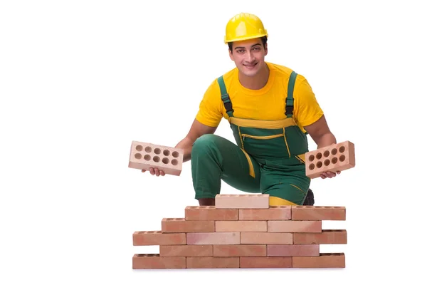 Przystojny budowlaniec buduje ceglany mur — Zdjęcie stockowe