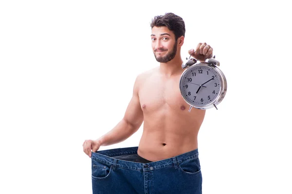 Homem em dieta conceito com jeans de grandes dimensões — Fotografia de Stock