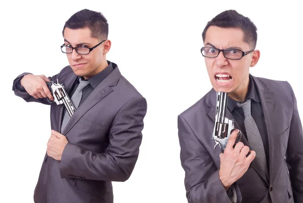 Uomo d'affari divertente con pistola su bianco — Foto Stock