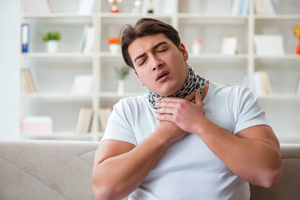 Young man suffering from sore throat — Stock Photo, Image