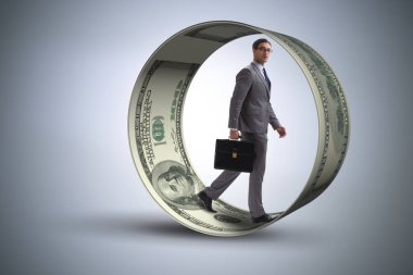 Hamster çarklı bir iş adamı dolarları kovalıyor.