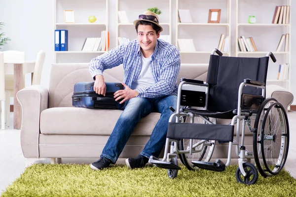 Young disabled man preparing for summer vacation — Stock Photo, Image