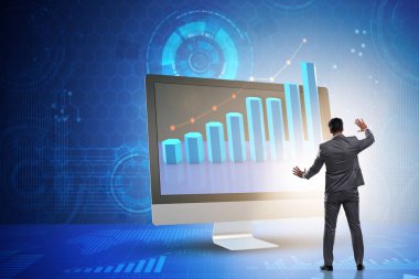 Grafiklerle ekonomi tahmini konseptinde iş adamı