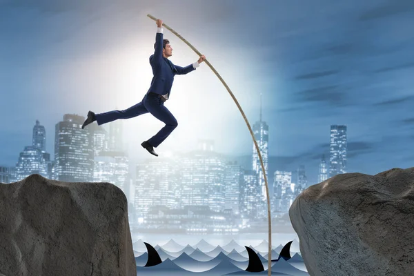 Businessman in pole vaulting concept — Stock Photo, Image