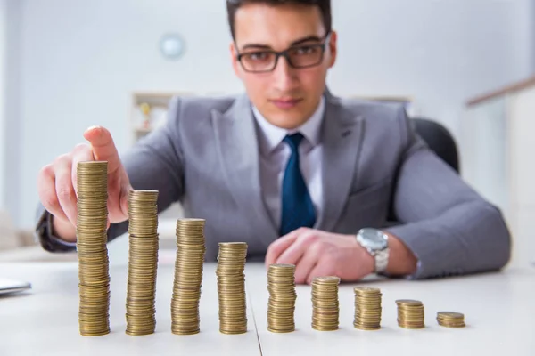 Businessman with golden coins in business growth concept — Stock Photo, Image