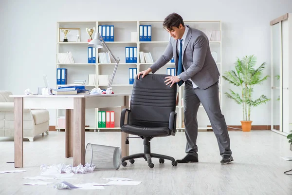 Businessman having fun taking a break in the office at work