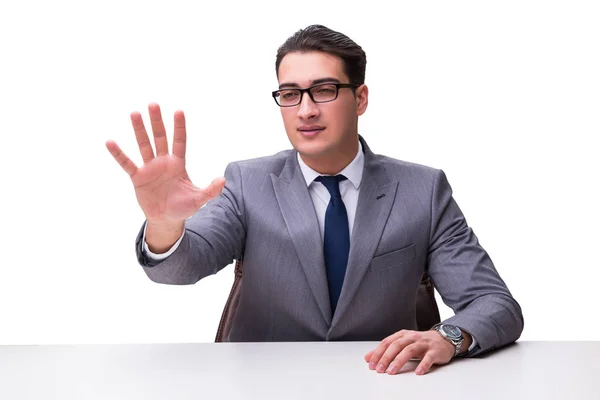 Молодий бізнесмен натискає віртуальні кнопки ізольовані на білому фоні — стокове фото