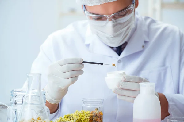 Chemist mixing perfumes in the lab