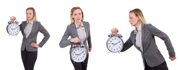 Mujer de negocios en traje gris con reloj despertador aislado en blanco — Foto de Stock