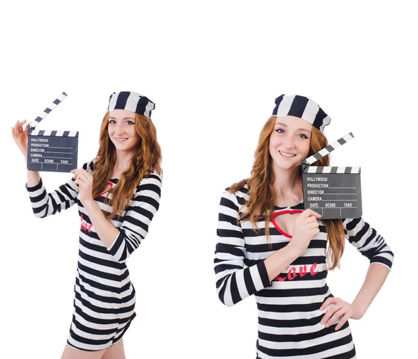 Young woman-prisoner with movie board isolated on white — Stock Photo, Image