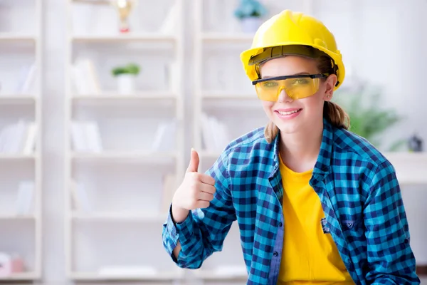 Female repairman carpenter cutting joining wooden planks doing r — Stock Photo, Image