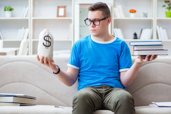 Young student preparing for exams studying at home on a sofa — Stock Photo, Image