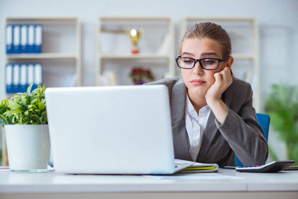 Young businesswoman accountant working in the office