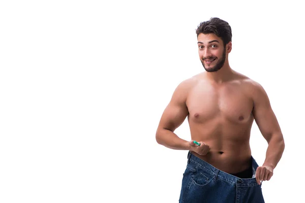 Mannen i bantning koncept med överdimensionerade jeans — Stockfoto