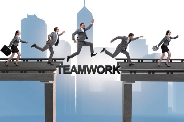 Teamwork concept with business people crossing bridge — Stock Photo, Image