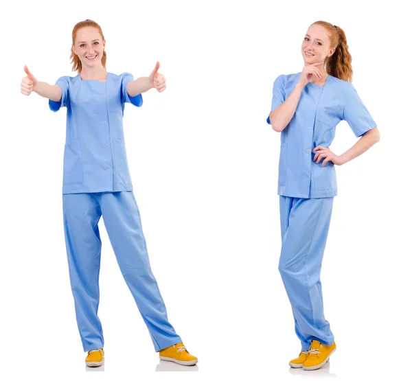 Grazioso medico in uniforme blu isolato su bianco — Foto Stock