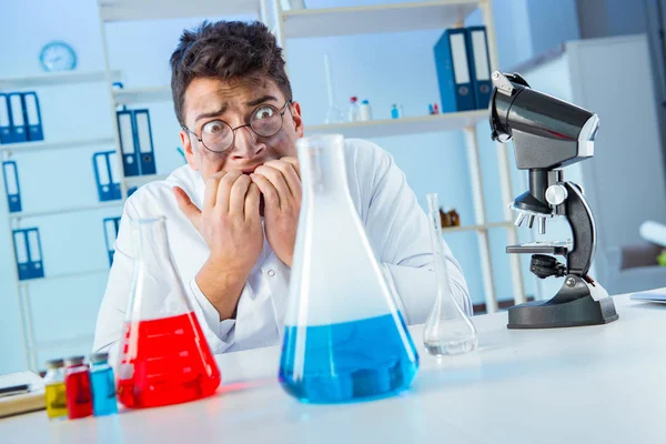 Funny mad chemist working in a laboratory — Stock Photo, Image