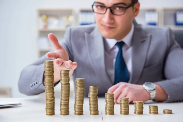 Businessman with golden coins in business growth concept — Stock Photo, Image