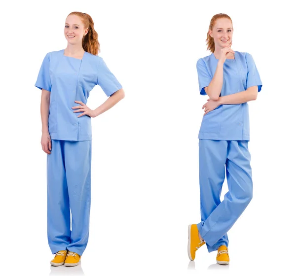 Bonito médico en uniforme azul aislado en blanco — Foto de Stock