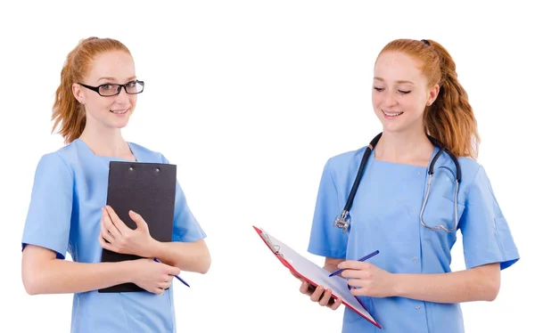 Hübsche Ärztin in blauer Uniform mit Dokumenten auf weißem Hintergrund — Stockfoto