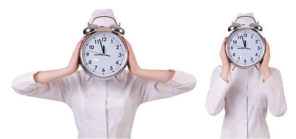 Çekici bir kadın doktor ile üzerine beyaz izole büyük saat — Stok fotoğraf