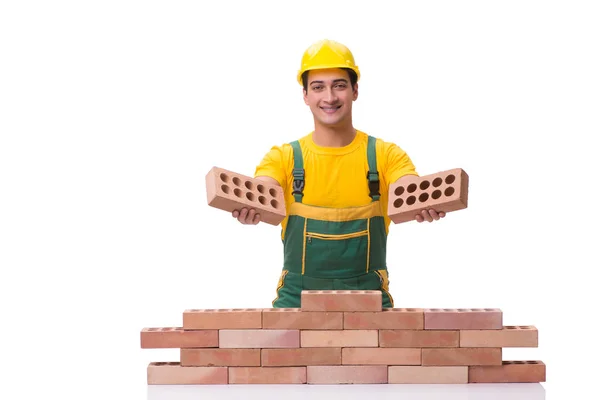 Der hübsche Bauarbeiter, der Ziegelmauer baut — Stockfoto