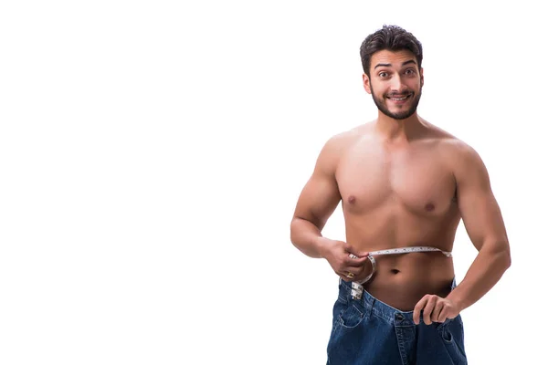Mies laihduttaminen käsite ylisuuret farkut — kuvapankkivalokuva