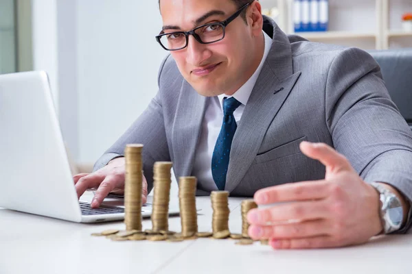 Man with coins in the office — Stock Photo, Image