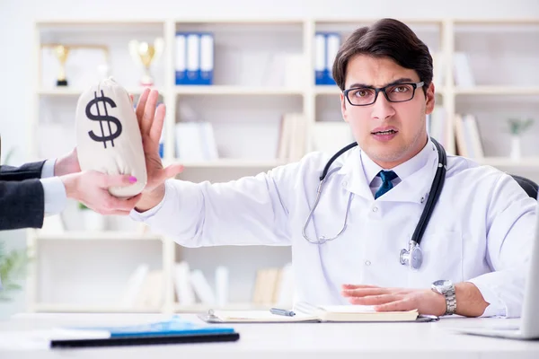 Young doctor in medical insurance fraud concept