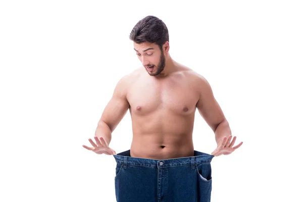 Homem em dieta conceito com jeans de grandes dimensões — Fotografia de Stock